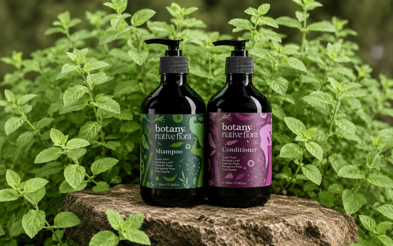 BNF Shampoo and Conditioner sitting on a rock in front of river mint